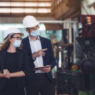 Engineer with digital tablet supervising autonomous producton pr Engineer with digital tablet supervising autonomous producton process